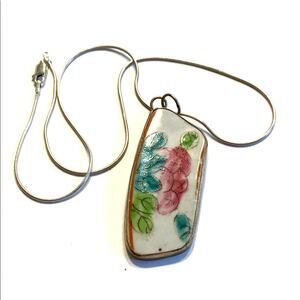 Silvertone slim chain necklace with Asian floral pottery chard pendant